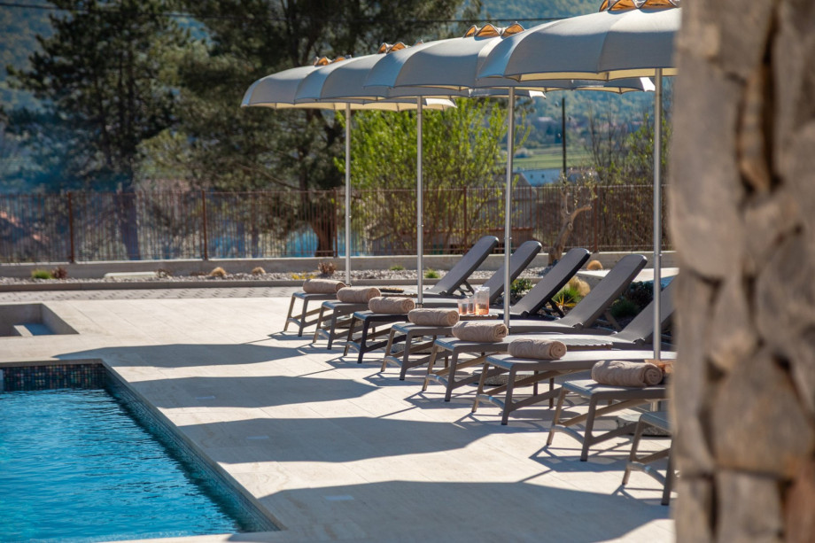 Sun deck area with 8 lounge chairs and umbrellas provides the perfect spot to relax