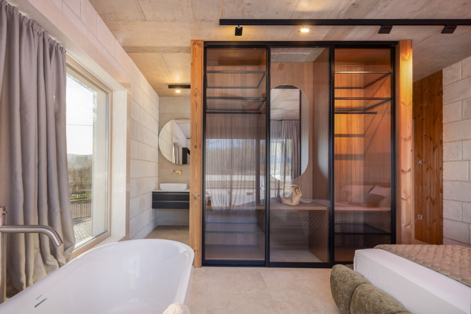 The villa offers 4 elegant en-suite bedrooms, each featuring a luxurious king-size bed (180 cm x 200 cm), a TV, air-conditioning, and direct access to the pool area