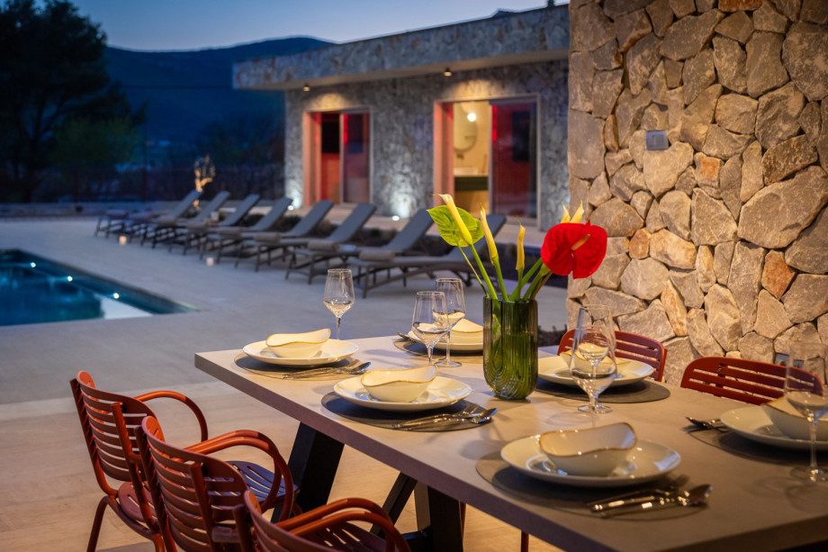 Dine al fresco in the covered outdoor dining area (30 sqm), featuring a barbecue grill