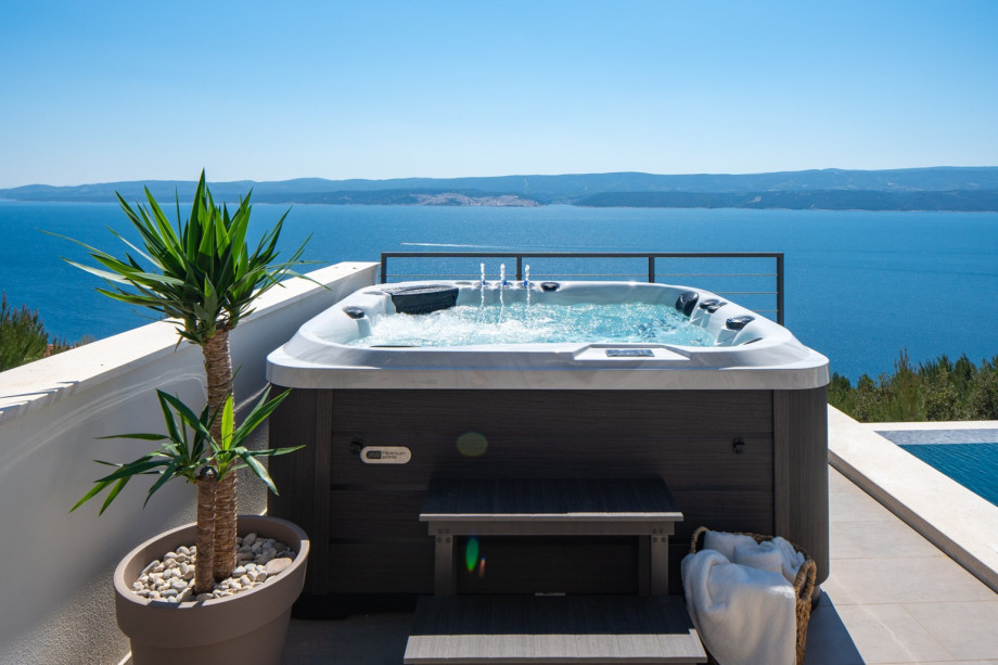 Unwind in the inviting hot tub or soak up the sun on the spacious sun deck