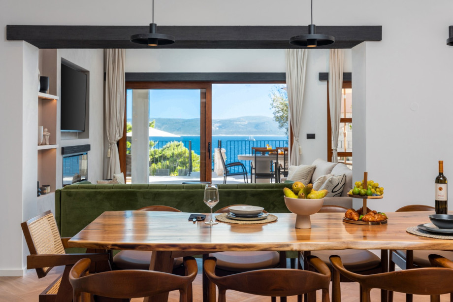 A wooden dining table for 8, sofas with flat screen TV, Netflix and HBO,