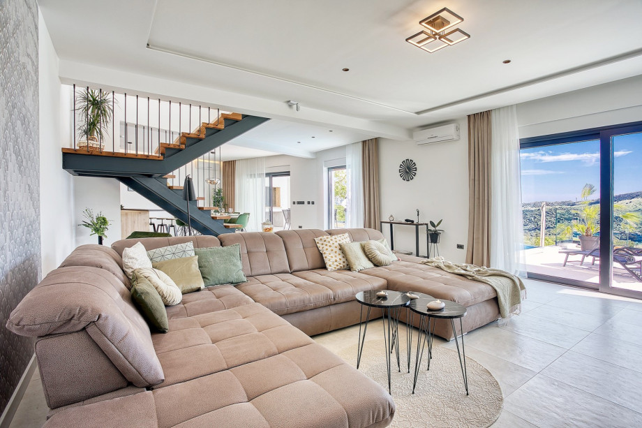 A spacious living room with a comfortable sofa