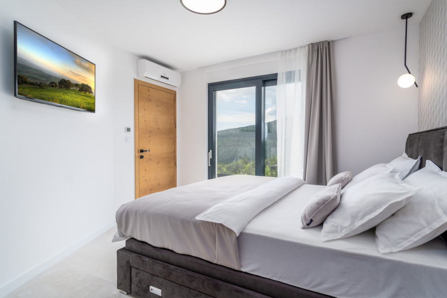 Bedroom No1 also offers a TV, A/C, and an exit to the terrace next to the pool