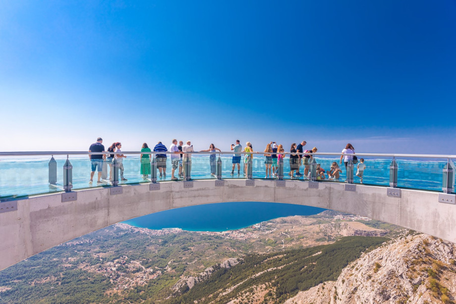 Horseshoe-shaped lookout outside the cliff with a glass walking surface hold Skywalk Biokovo