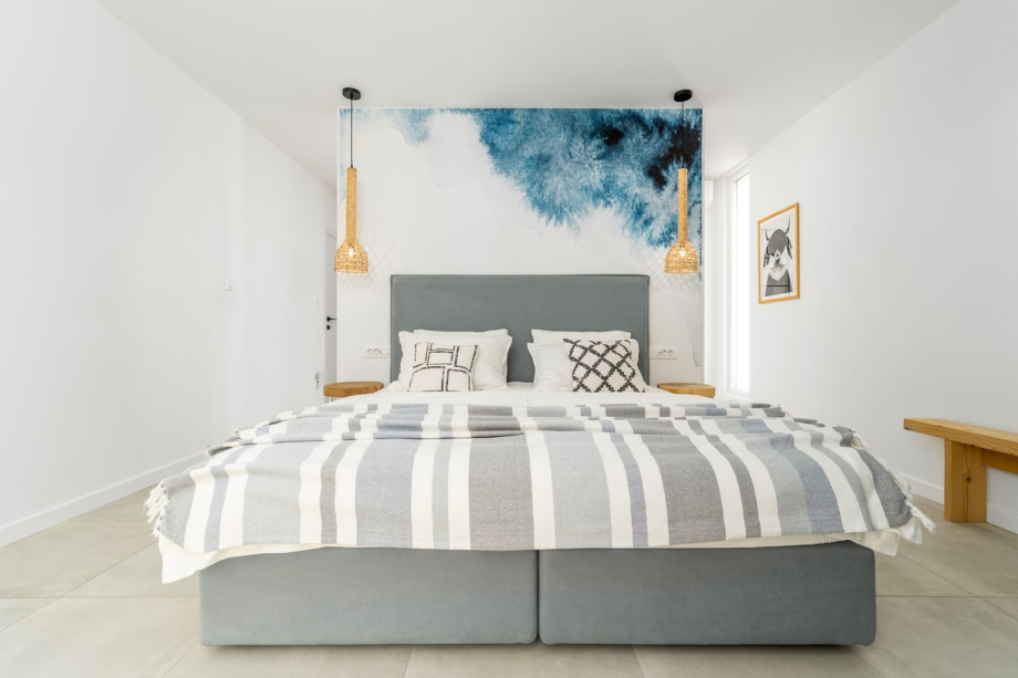 A Master Bedroom No 4 with king-size bed 180cm x 200cm, TV, A/C, ensuite bathroom with shower, a balcony with pool views.