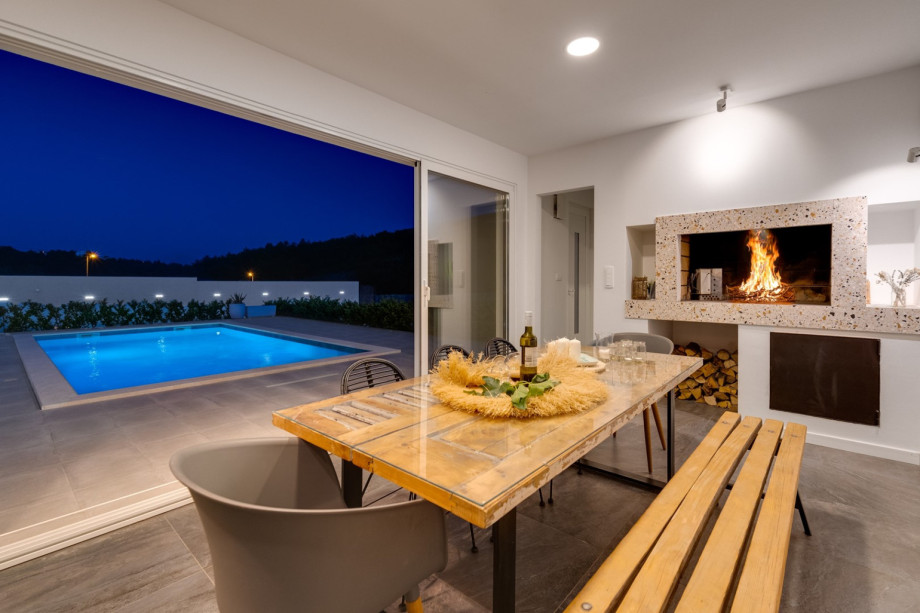 Enjoy the summer kitchen next to the pool