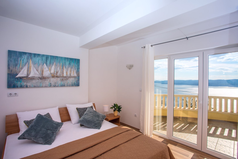 Bedroom NO1 with double bed and exit on the terrace with a sea view, 1st floor