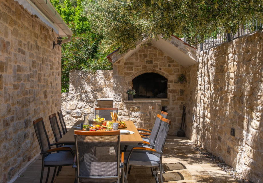 In front of the Villa is a BBQ grill with a dining table. Perfect for quiet evenings