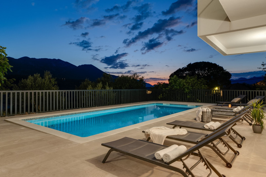 Large sun deck area with eight deck chairs, an outdoor shower,