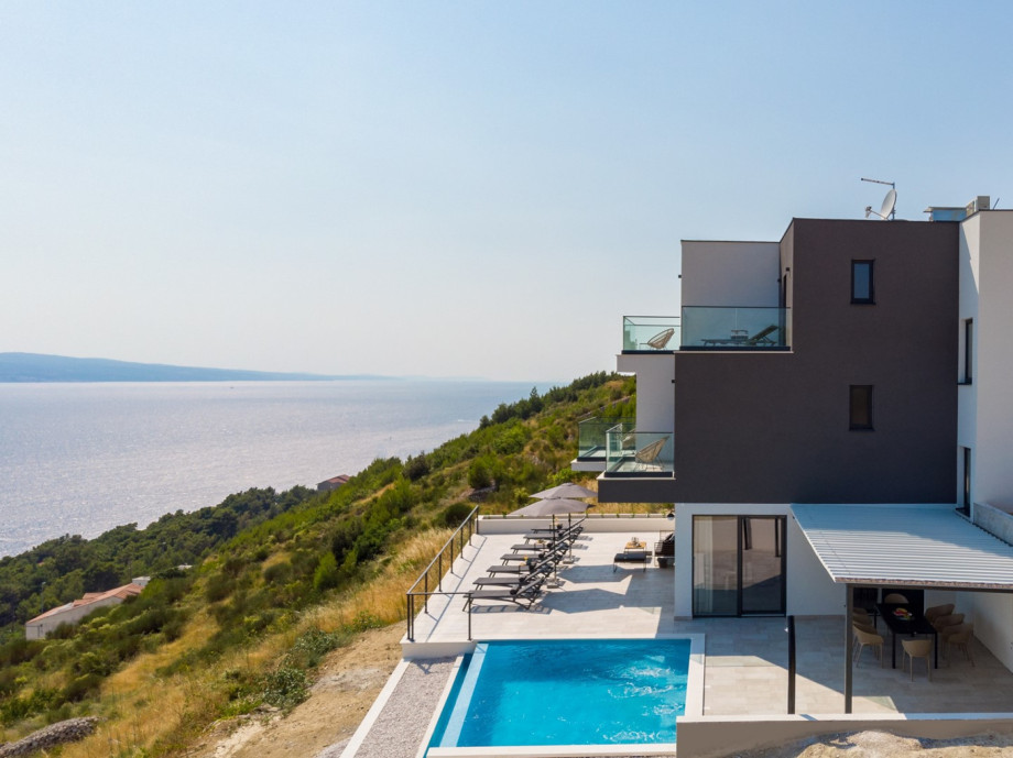 Villa is surrounded with shades of green and blue