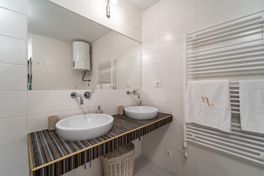 Family bathroom with a shower and washing machine