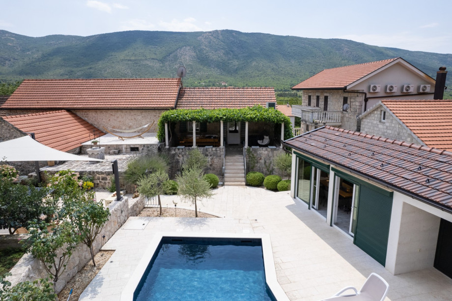 Relaxing outdoor courtyard with pool and natural surroundings.