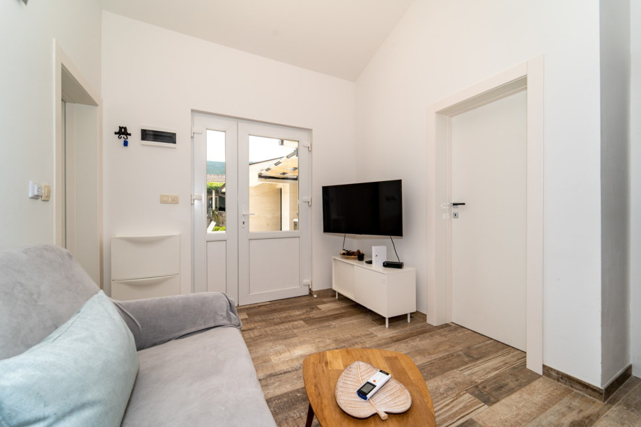 Airconditioned living/dining area and fully equipped kitchen with direct approach to the pool