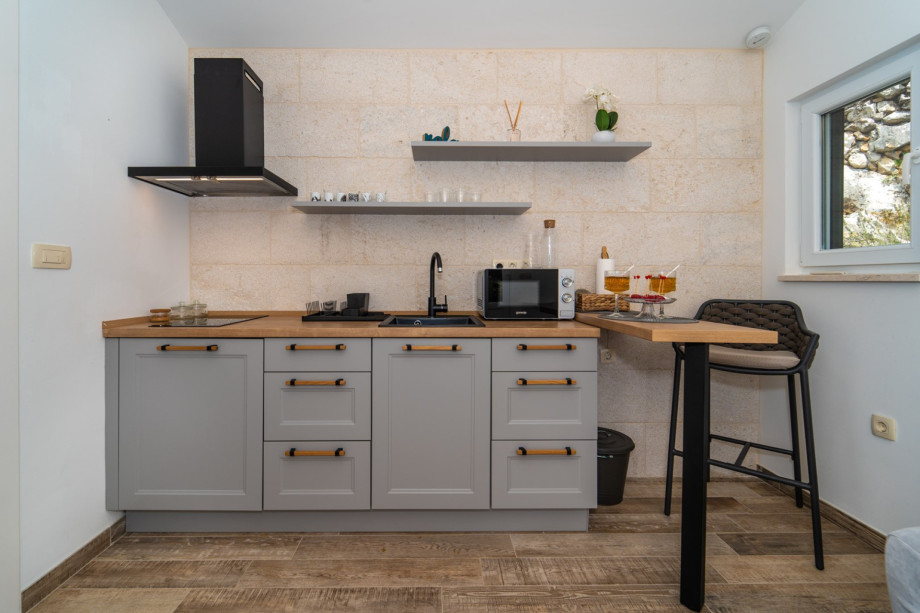 Airconditioned living/dining area and fully equipped kitchen with direct approach to the pool