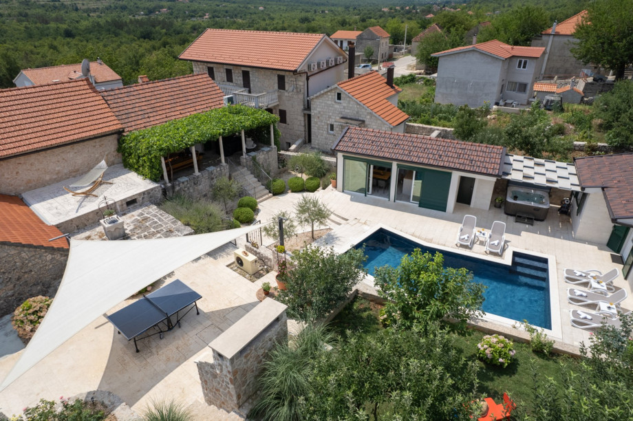 A spacious grassy garden connects the properties, providing a great spot for afternoon coffee or playtime with your pet