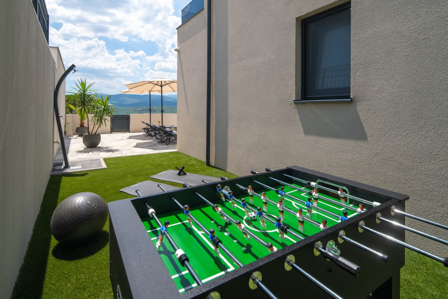 Outdoor play and entertainment area, enriched with several exercise equipment