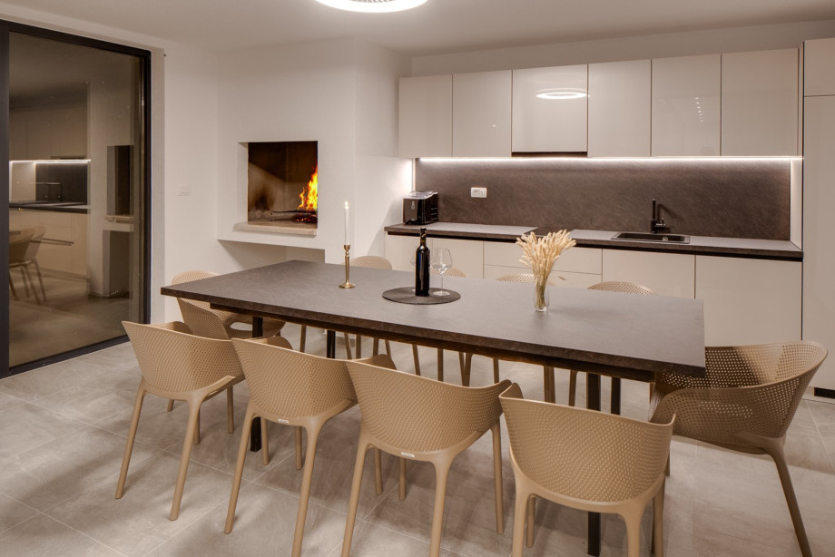 Step outside to discover your very own private retreat: a covered dinning area