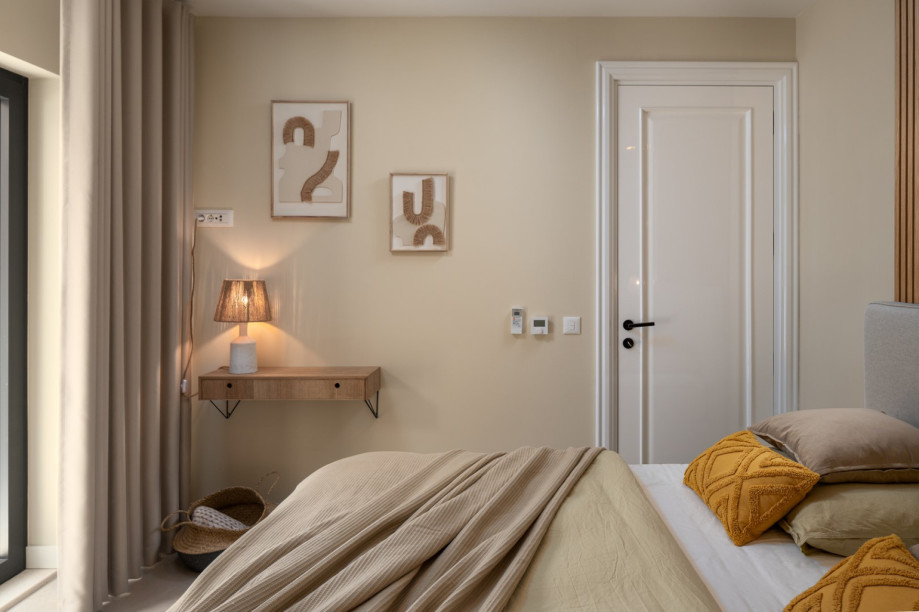 A Bedroom NO2 also offers glass doors to a small terrace on the East side, which overlooks the neighborhood