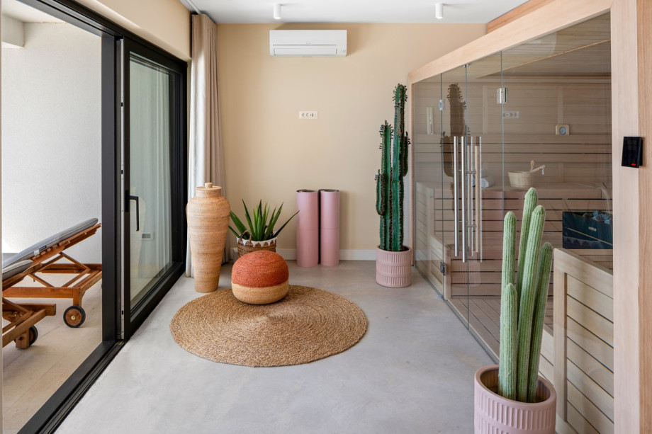 The glass doors lead to a spa area that includes a large Finnish sauna with a view of the Adriatic sea
