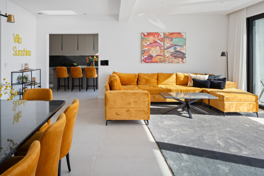 Living room, dining area, and kitchen are all connected by an open-plan layout