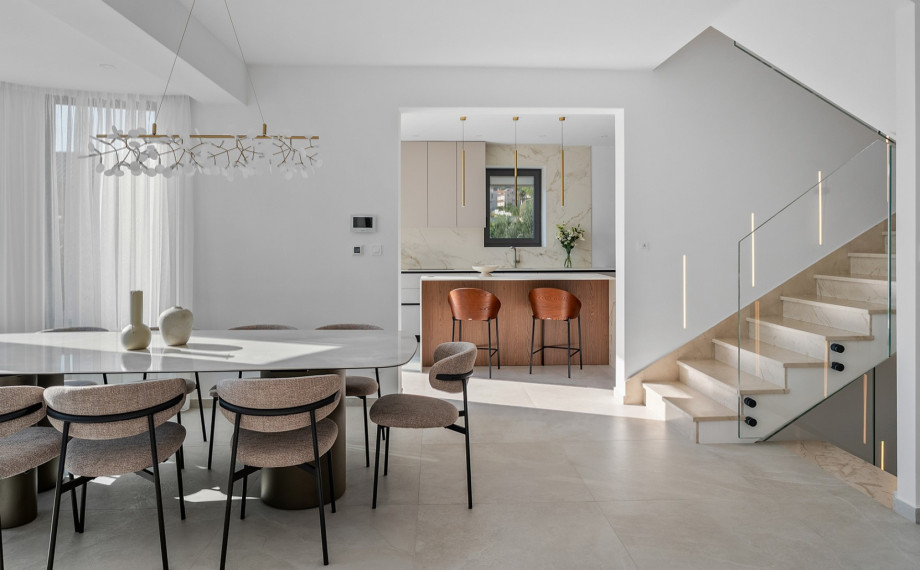 The first floor showcases a stylish and fully equipped kitchen