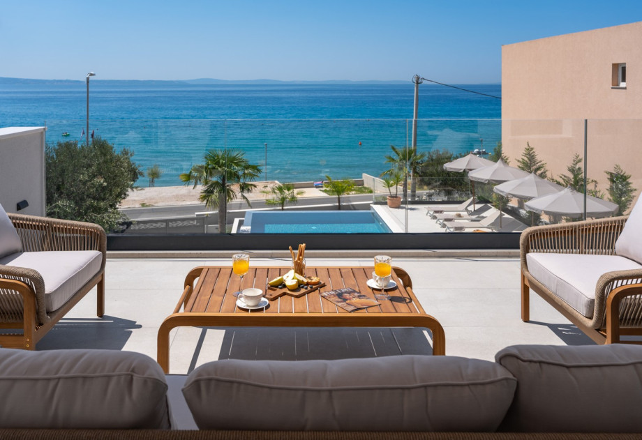 Adorned with a cozy lounge corner, boasts spectacular sea views.