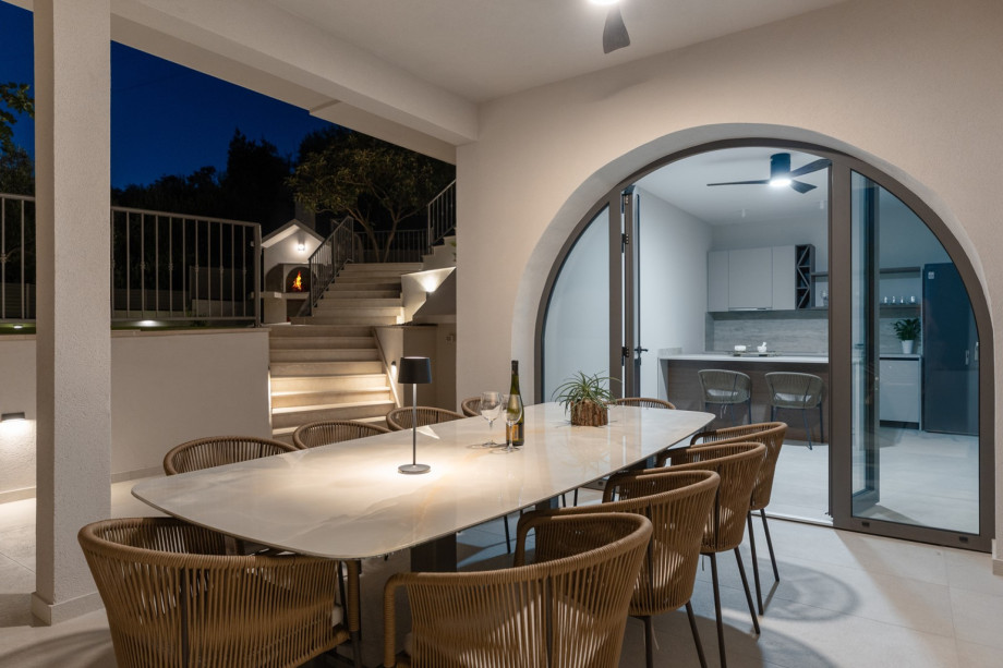 A cozy lounge corner adjacent to the pool, providing a perfect spot to unwind.