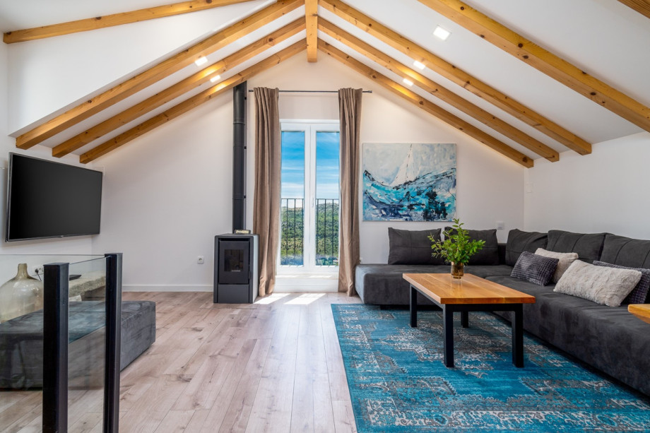 A living room with air-condition, flat-screen TV, free WiFi, Netflix, etc.