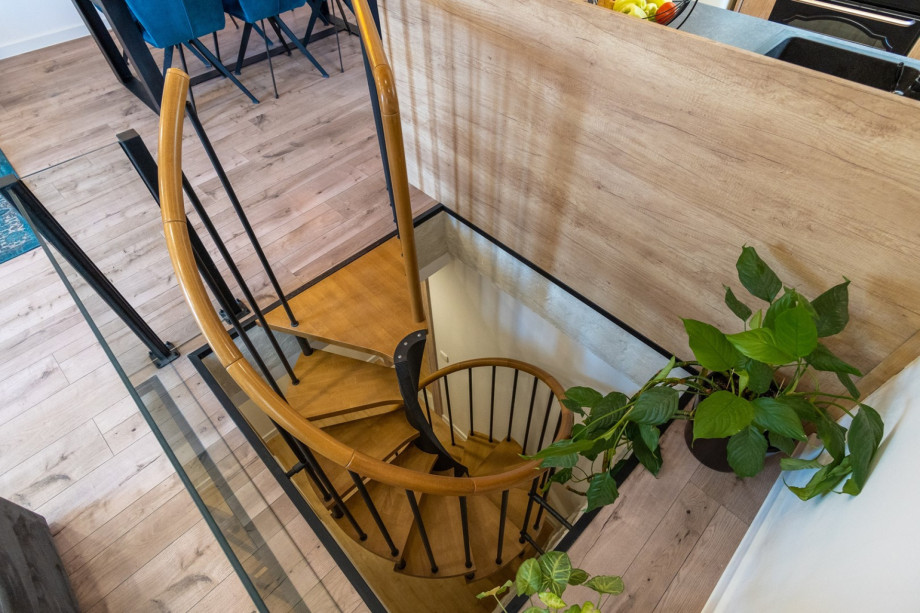 Spiral stairs take you to the bedroom area