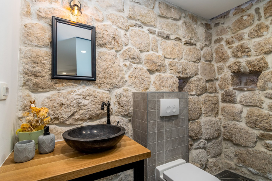An en- suite bathroom with a shower, a toilet and a sink