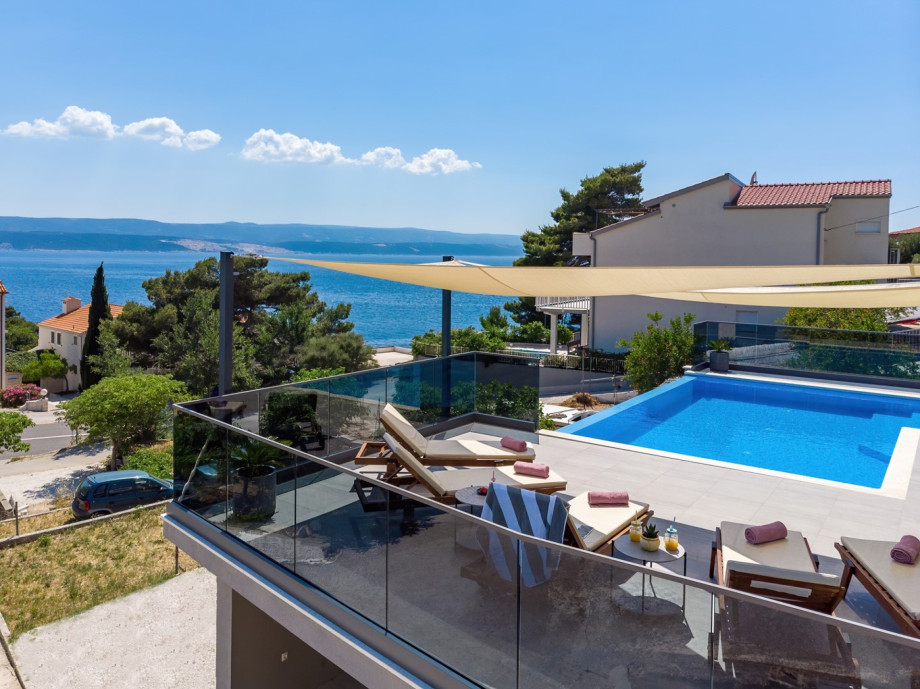 Private 32sqm heated pool with 6 lounge chairs and outdoor furniture