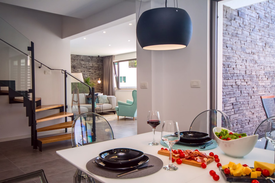 Connected dining and living area and stairs for upper floor