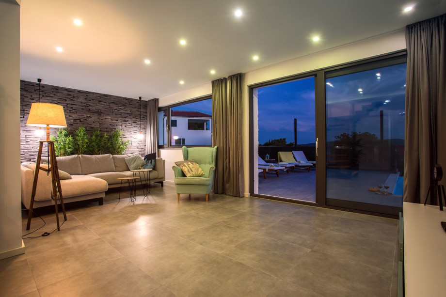 Living area and night view on the pool