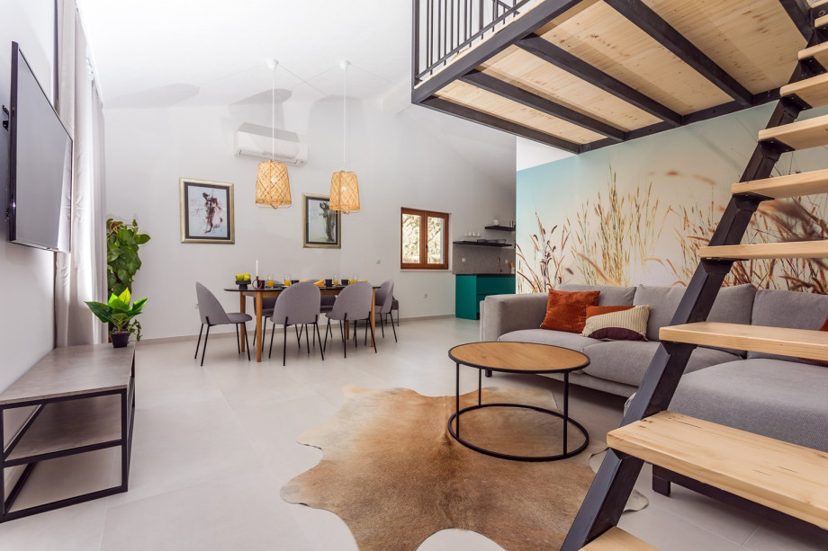 First Living room with a fully equipped kitchen,