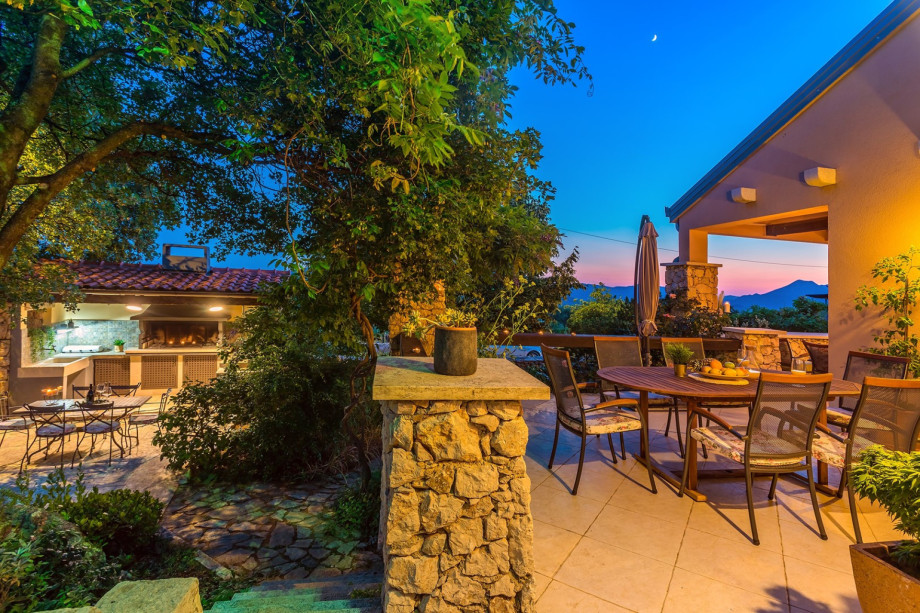 Out door dining area next to the kitchen and BBQ