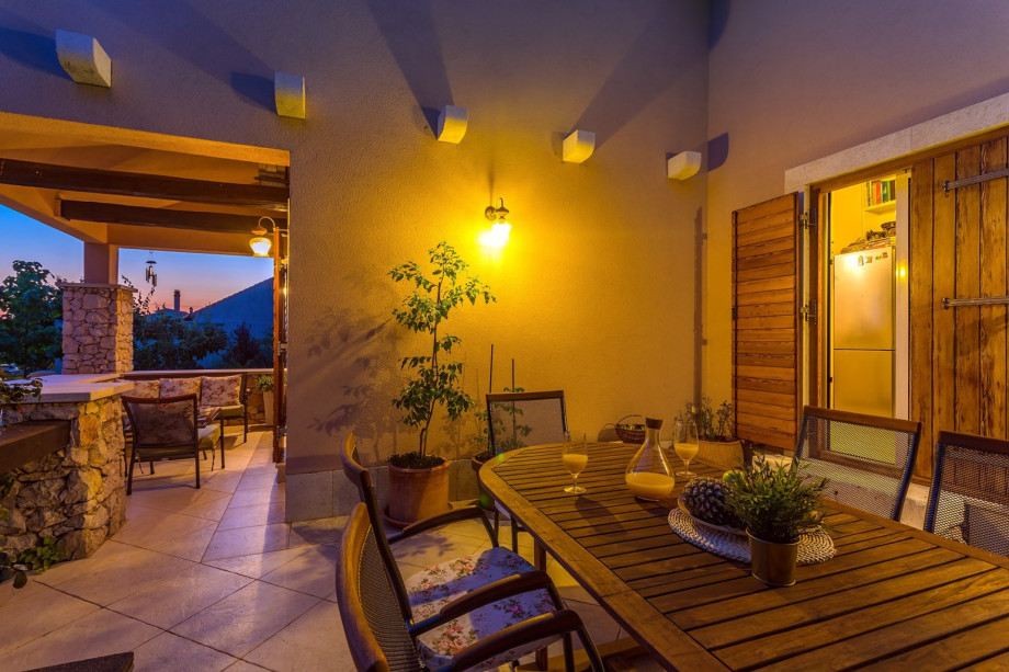 Out door dining area next to the kitchen and BBQ