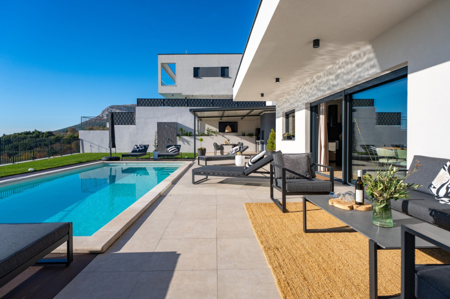 The seamless transition from the indoor dining area to the sun terrace offers stunning views of Split.