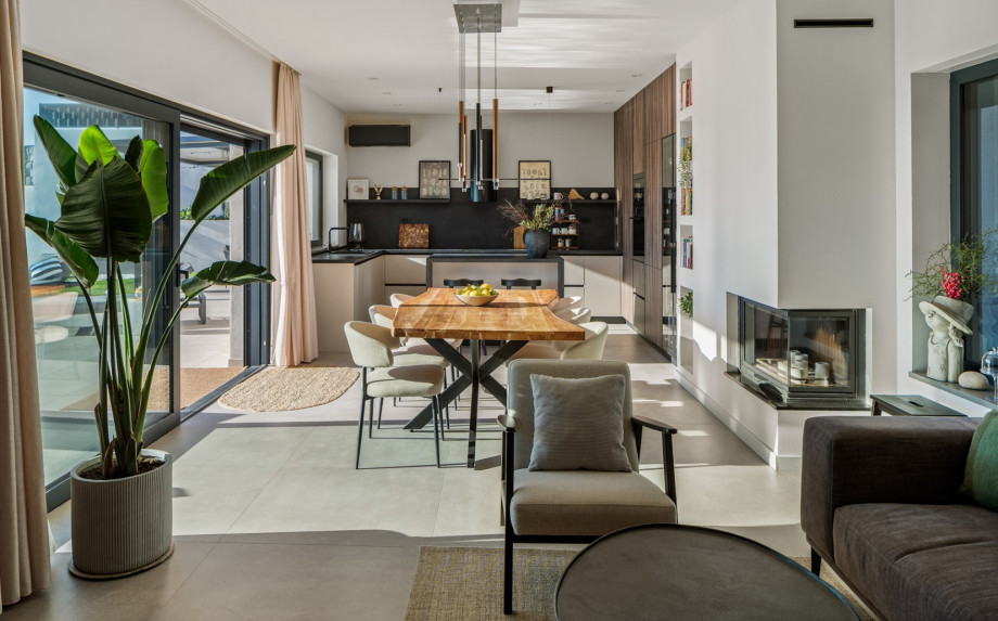 Chic, air-conditioned living room and fully equipped kitchen with a striking central kitchen island.