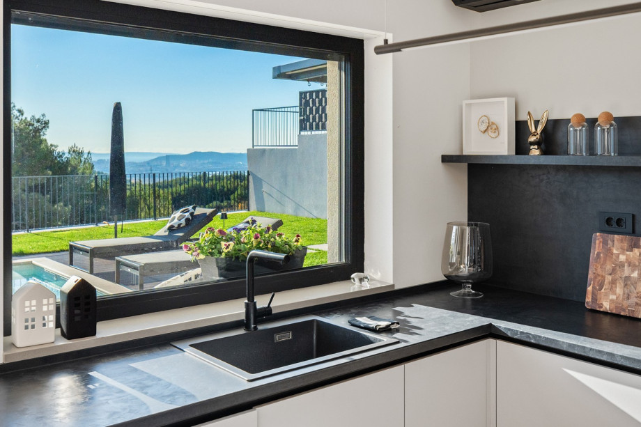 Kitchen window over the sink area offering stunning views of Split and the private outdoor oasis.