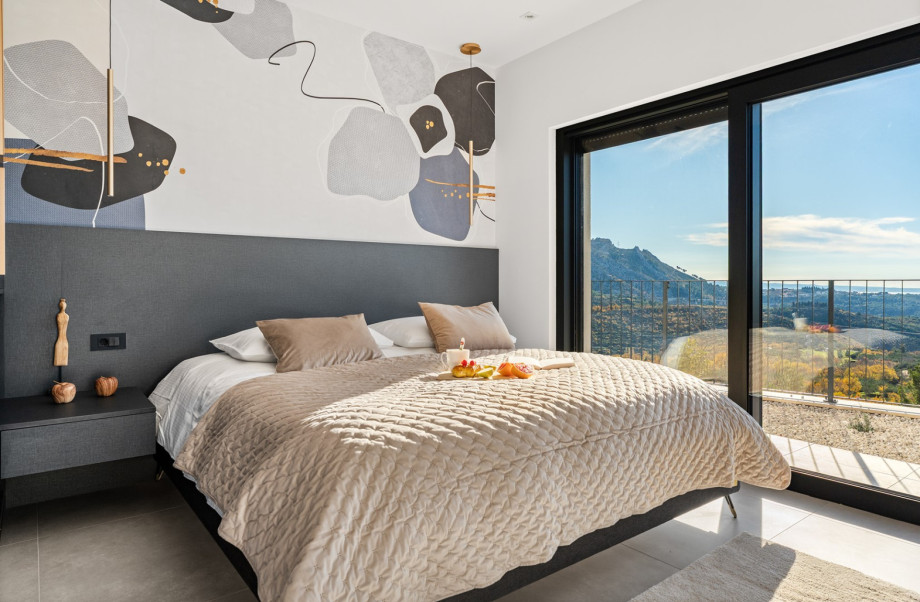 Master Bedroom (23 sqm) with a luxurious king-size bed, featuring direct access to the pool area.