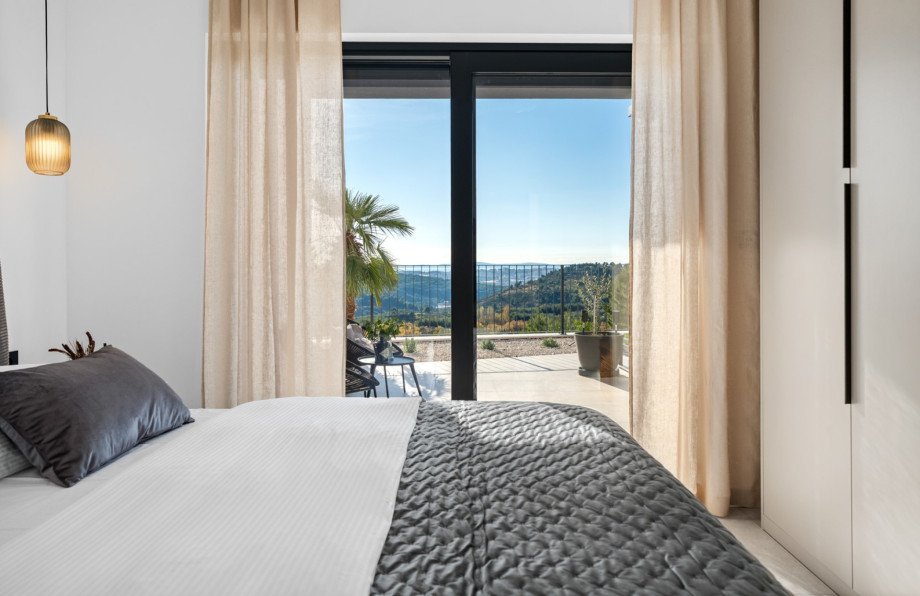 Bedroom 2 with a king-size bed, air-conditioning, and direct outdoor access overlooking the pool and Split.