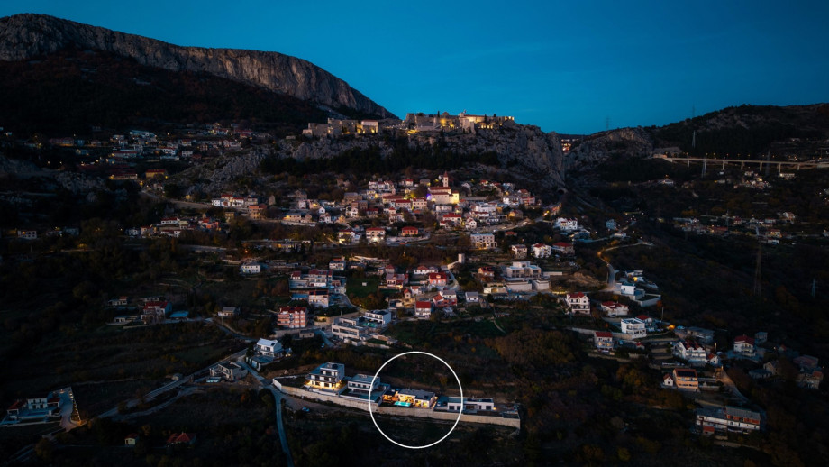 The view of the villa (circled) in the Klis region at dusk, near the historic Klis Fortress.