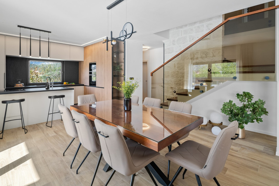Bright open-plan living area and a fully equipped kitchen with a stylish dining table for ten.