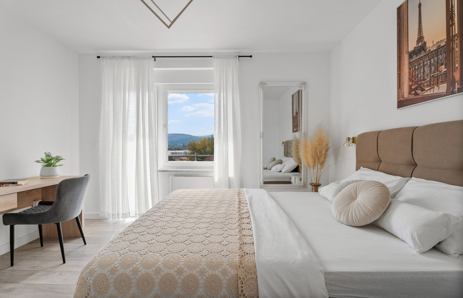 Bedroom 1 features a Queen-sized bed and is equipped with air conditioning for ultimate comfort.