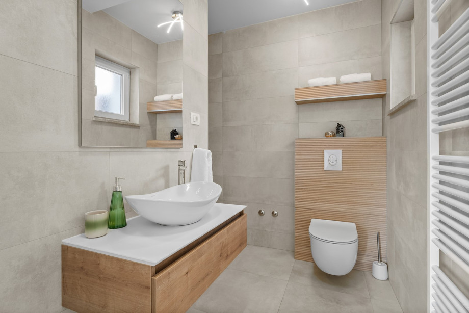 The villa features a family bathroom with a shower located on the upper floor, near the bedrooms.