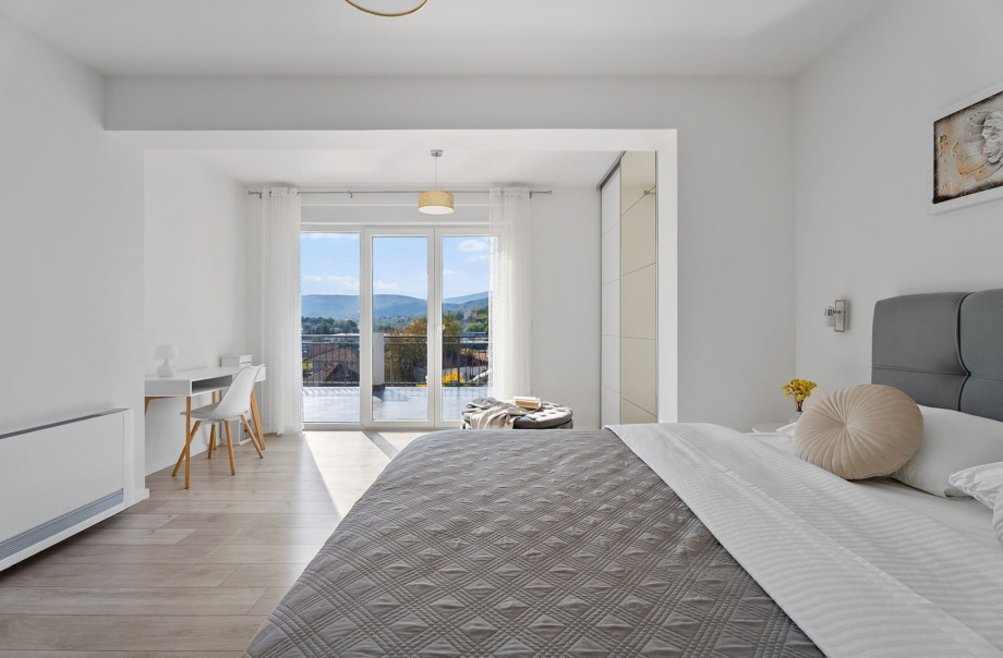 Master Bedroom 3 on the upper floor boasts a spacious terrace access with panoramic views of the neighbourhood and pool.