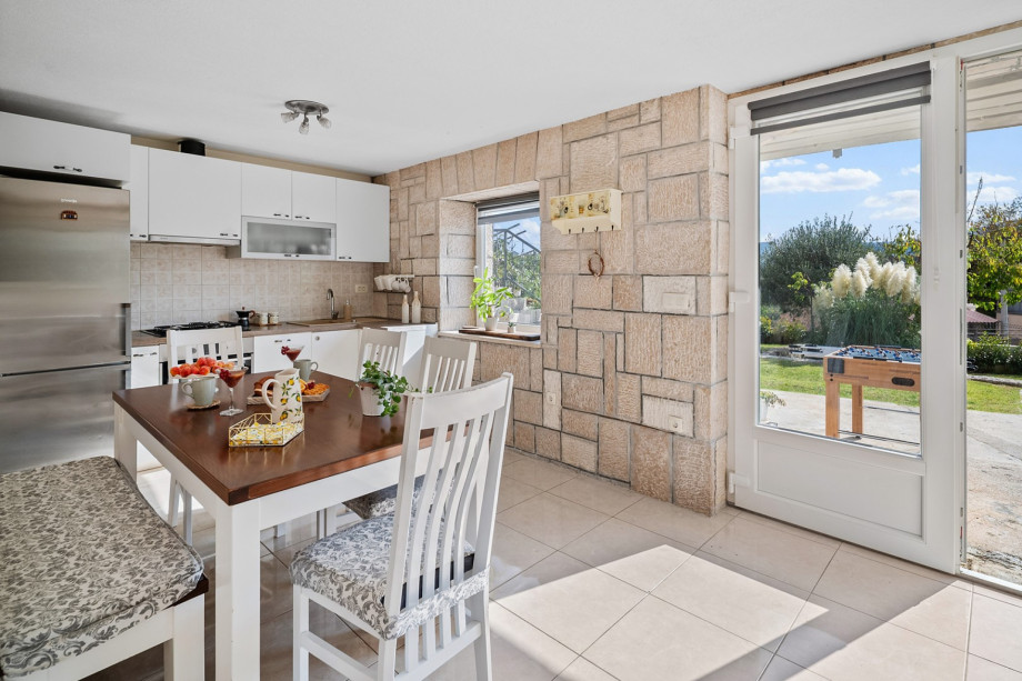 The ground floor kitchen and dining area provide easy access to the outdoor spaces.
