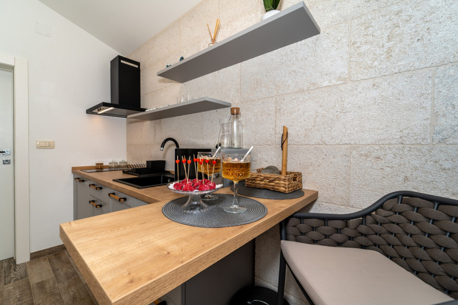 Airconditioned living/dining area and fully equipped kitchen with direct approach to the pool