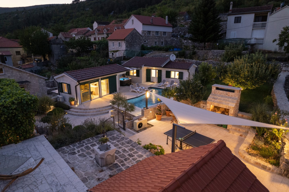 A spacious grassy garden connects the properties, providing a great spot for afternoon coffee or playtime with your pet