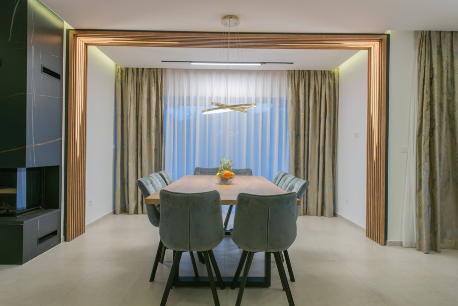 Stylish dining area with a table and elegant lighting.
